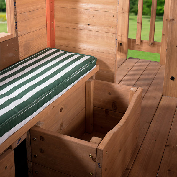 A cozy sitting space atop compact storage for toys and kitchen foods.