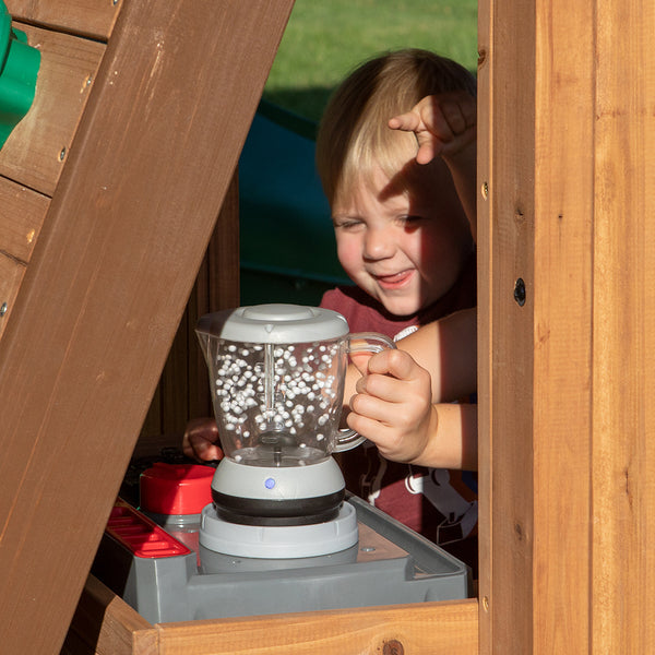 The more you look, the more you’ll find on this swing set. Play stove, balconies, chalk boards, trapeze swing, and a telescope.