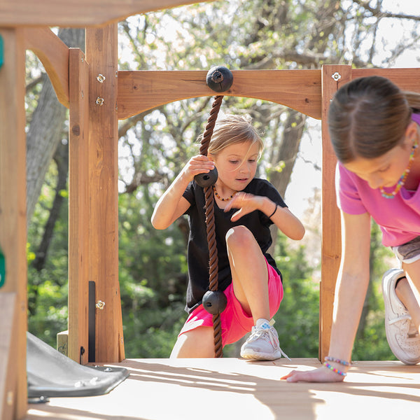 Featuring a combination of climbing options on both sides of the covered clubhouse, it’s a great choice for improving balance, motor skills, and hand/eye coordination. And when they need a break, kids can relax at the freestanding picnic table or on the disc web swing.