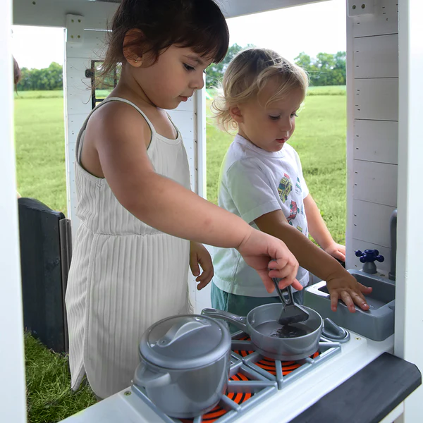 A tiny baker's gourmet kitchen where they can cook up creativity with a sink, stove, cordless phone, working doorbell, and pot and pan set with utensils.