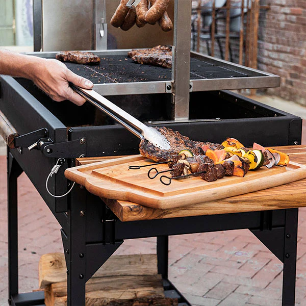 Santa Maria-style precision with adjustable grill grates from 2” to 24”, allowing for searing and slow cooking.
